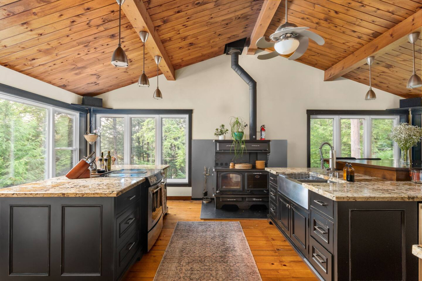 Cottage kitchen with vaulted wood ceiling